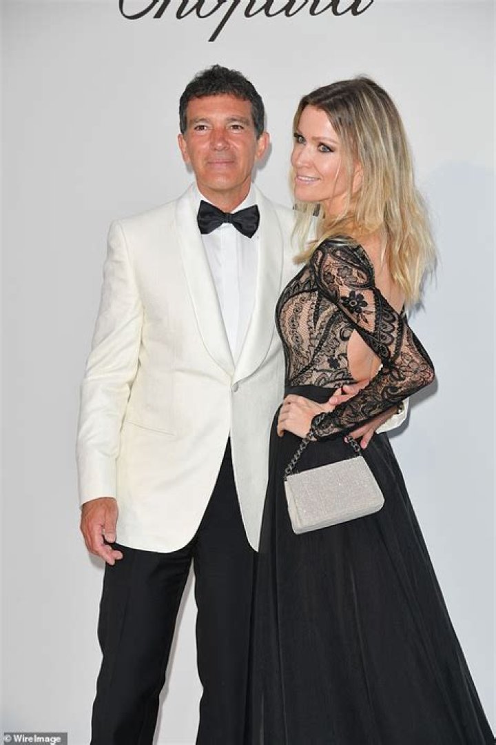 Antonio Banderas, 58, looks suave in a white tuxedo with glamorous